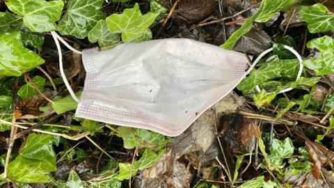 Discarded disposable face mask