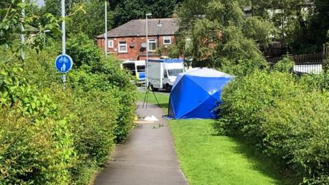 Forensic tent near to the Sandbrook retail centre in Rochdale
