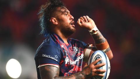 Nathan Hughes celebrates scoring a try against Gloucester