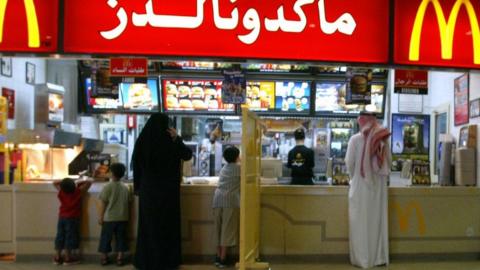 A segregation board separates women and families from men at a McDonalds restaurant in Riyadh. File photo