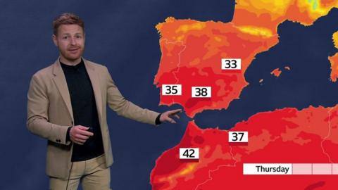 Tomasz Schafernaker stands in front of a weather map showing high temperatures expected in Iberia and north Africa later this week