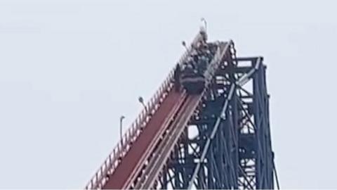 Passengers stuck at the top of a rollercoaster in Blackpool