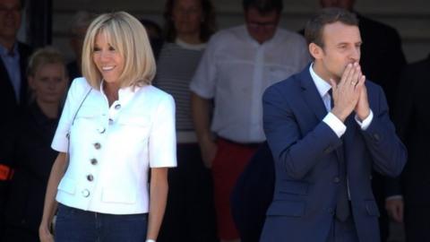 macron leaves polling station with wife Brigitte after voting