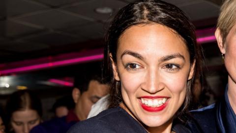 Progressive challenger Alexandria Ocasio-Cortez smiling on her primary election night