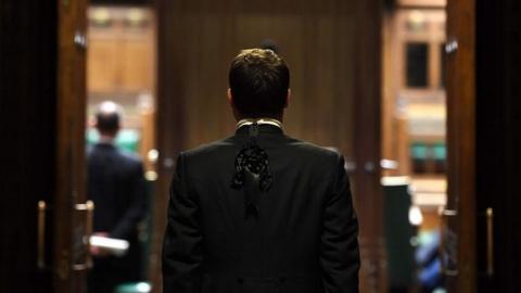 The Speaker's Trainbearer outside the chamber of the House of Commons