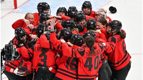 Canada players celebrating their win against the USA