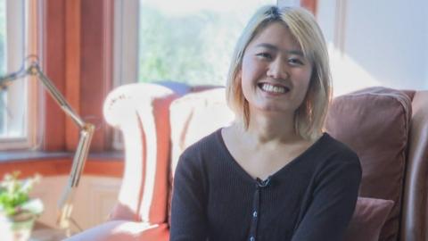 Tiffiny Li sitting in her livingroom