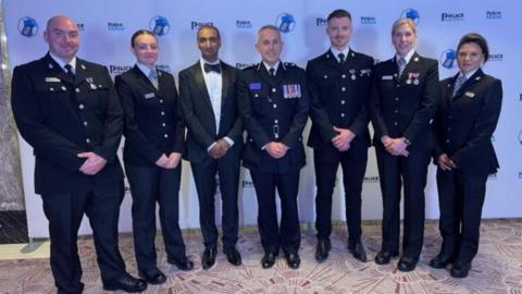 Police officers stood in line at awards ceremony