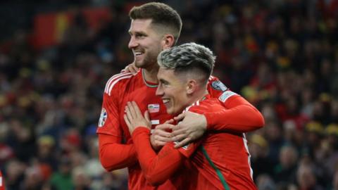 Chris Mepham and Harry Wilson celebrating