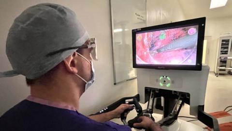 Surgeon sat at console during a thoracic surgery