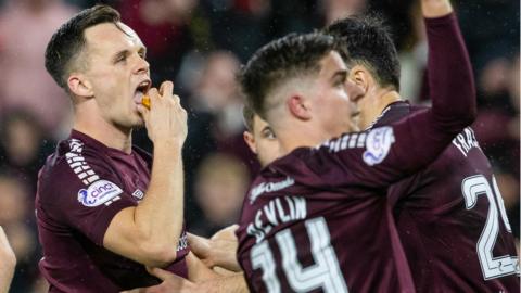 Lawrence Shankland celebrates scoring penalty