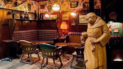 Monk statue in bar