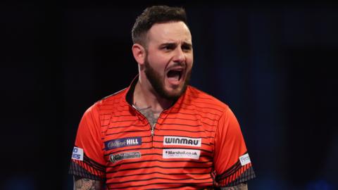 Darts player Joe Cullen celebrates