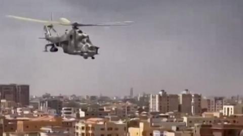 Attack helicopter flying low over Sudan's capital city