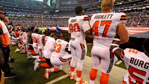 Some Cleveland Browns players kneel and others stand during protest on Sunday.
