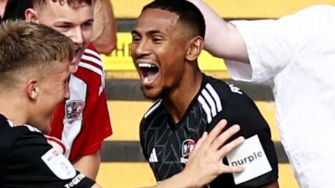 Demetri Mitchell celebrates scoring against Leyton Orient