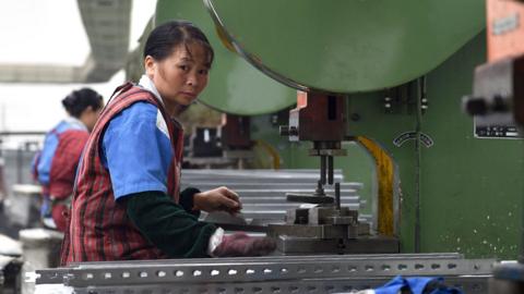 A worker in a factory that produces steel tools for scaffold in Jinhua, Zhejiang province, China on 7th June 2015.