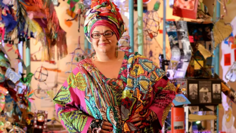 Camila Batmanghelidjh, dressed in her usual colours, smiles at the camera