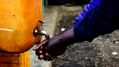 Hands being washed