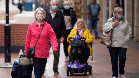 Shoppers wearing face masks