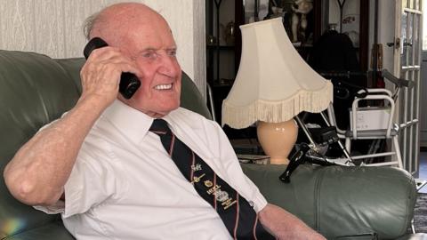 Ernie Lornie on a "welfare call" to a D-Day veteran's family