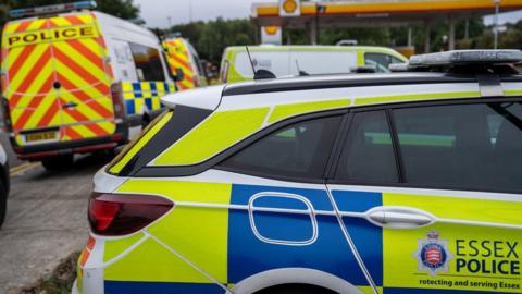 A number of Essex Police vehicles in a petrol station