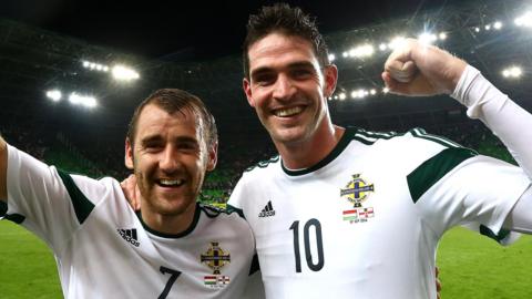 Niall McGinn and Kyle Lafferty celebrate after Northern Ireland's win in Budapest in September 2014