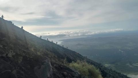 Rescuers climb Mayon Volcano to search for wreckage of a crashed Cessna 340 plane.