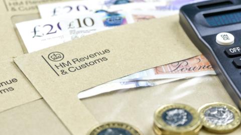 Coins, notes and an HMRC envelope