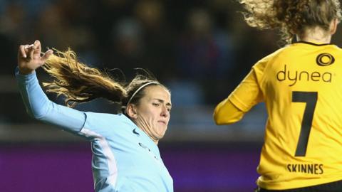 Jill Scott of Manchester City Women challenges for the ball against LSK Kvinner's Synne Skinnes Hansen