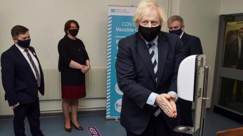 Boris Johnson sanitising his hands