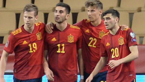 Spain players celebrate after scoring against Kosovo