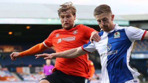 Luton's Luke Berry challenges Scott Wharton