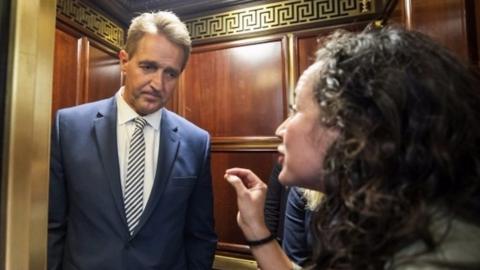 Protestor confronts Senator Jeff Flake in elevator after he announces he is voting to confirm Brett Kavanaugh nomination