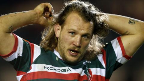 Sam Harrison ties his hair back while in action for Leicester Tigers