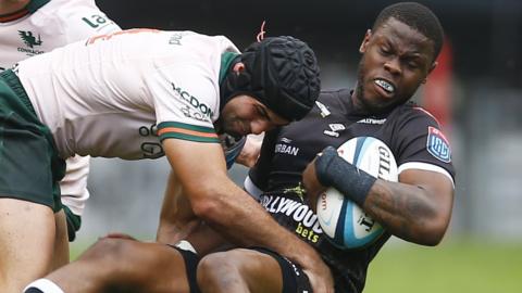 Connacht's Byron Ralston tackles Sharks full-back Aphelele Fassi in Durban