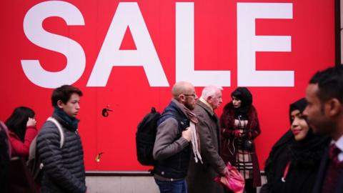 Sales shoppers pack Oxford Street in London, England, on December 28, 2018