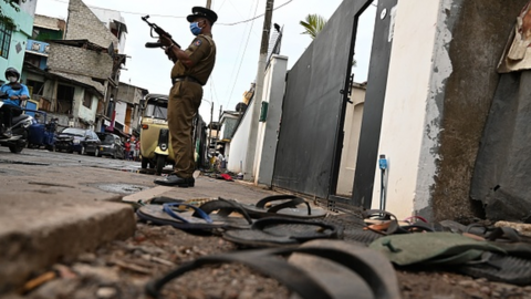 Police outside a warehouse in Colombo