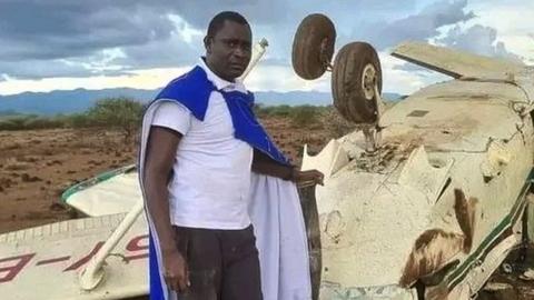 David Rudisha with the wreckage of a plane in Kajiado county in Kenya