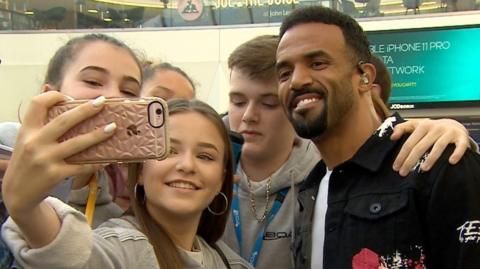 Singer Craig David surprised commuters by performing at Birmingham New Street railway station as part of BBC Music Day.