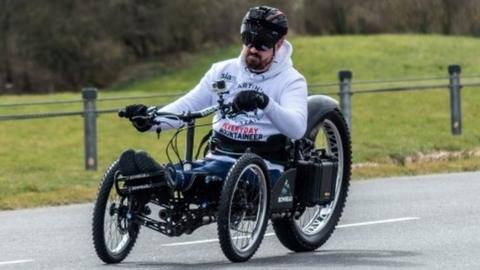 Martin Hibbert riding in a custom-built handbike