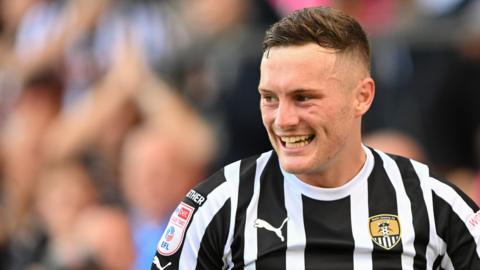 Macaulay Langstaff smiles while in action for Notts County in League Two