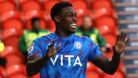 Isaac Olaofe celebrates scoring for Stockport