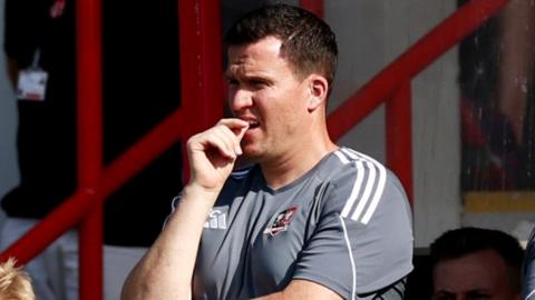 Gary Caldwell looks on as his Exeter City side play Leyton Orient