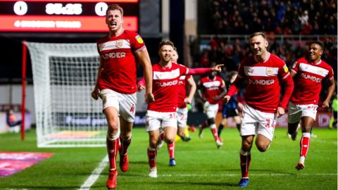 Adam Webster of Bristol City celebrates scoring a goal to make it 1-0