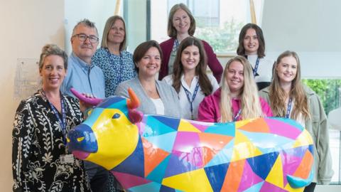 Sobell House staff with one of their ox sculptures