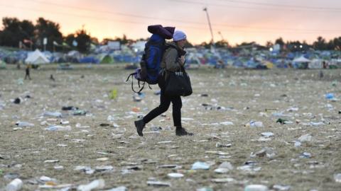 Woman leaving Glastonbury