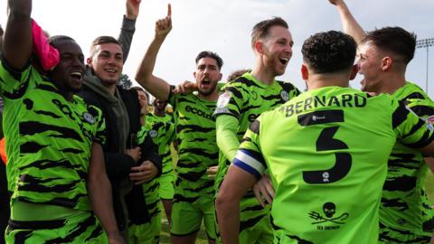 Forest Green players celebrate the team's promotion