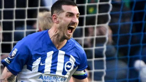 Lewis Dunk celebrates his stoppage-time equaliser for Brighton against Everton