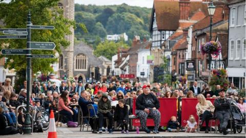 A crowd gathered in Henley on Thames to watch the Queen's funeral on a big screen